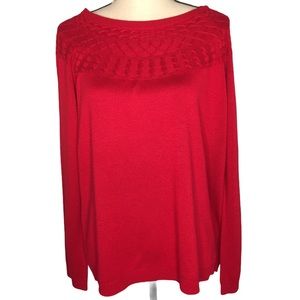 Kim Rogers red pull on sweater.